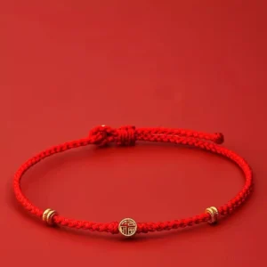 Handmade braided red string bracelet with 925 sterling silver Fu charm front view
