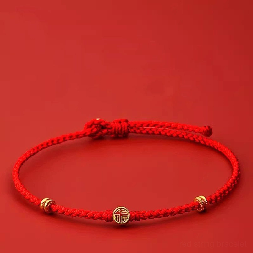Handmade braided red string bracelet with 925 sterling silver Fu charm front view
