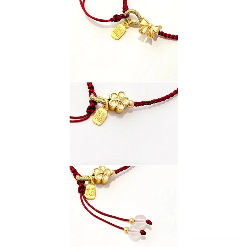 Handmade red string bracelet with gold charms and Fu character pendant showing natural material quality and craftsmanship