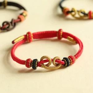 Handmade Red String Ingot Pattern Braided Protection Bracelet Flat Lay