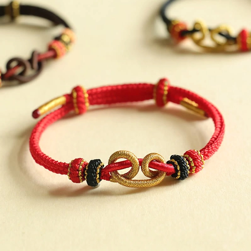 Handmade Red String Ingot Pattern Braided Protection Bracelet Flat Lay
