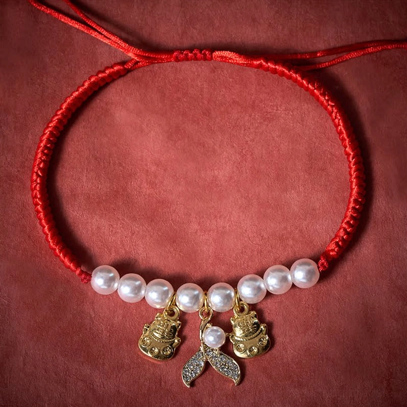 Handmade red braided pet collar with pearl beads and adjustable drawstring design dark background