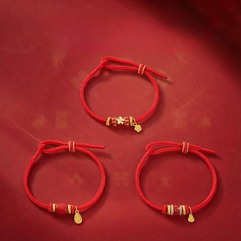 Handmade red string prosperity bracelet featuring copper beads and adjustable closure