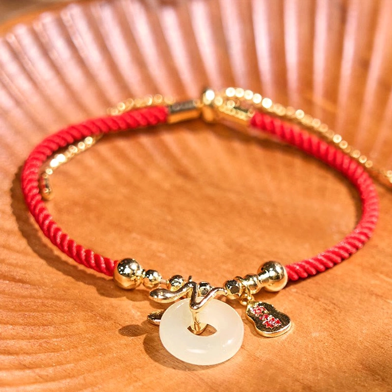 Full view handmade red woven cord bracelet with jade peace buckle and fu charm set