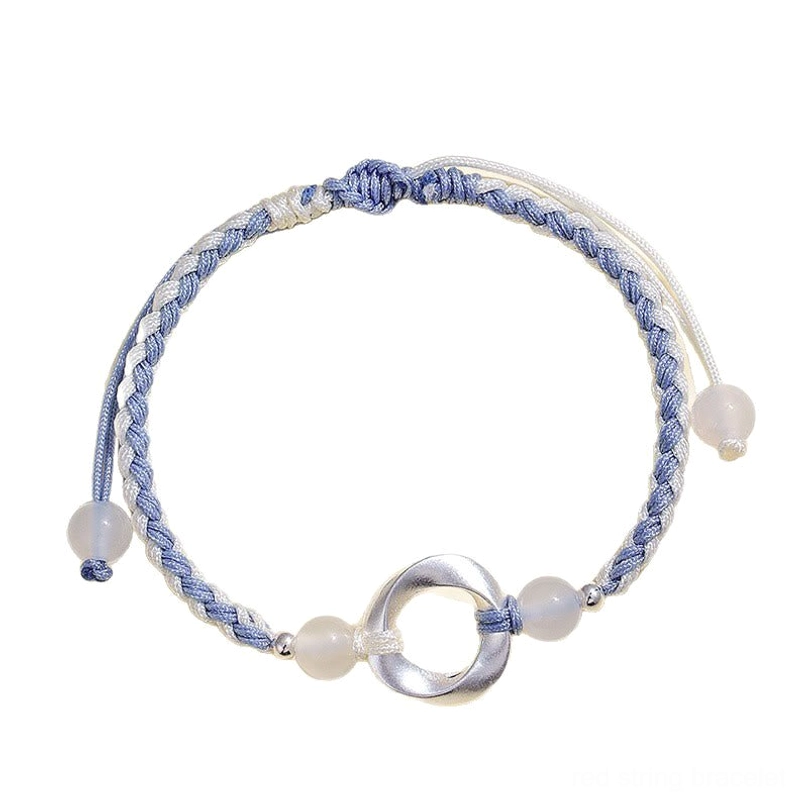 Handcrafted 925 sterling silver red string bracelet with white agate bead, adjustable design flat lay