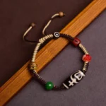 Handmade Tibetan Dzi Bead Red String Bracelet Three Quarter Side View