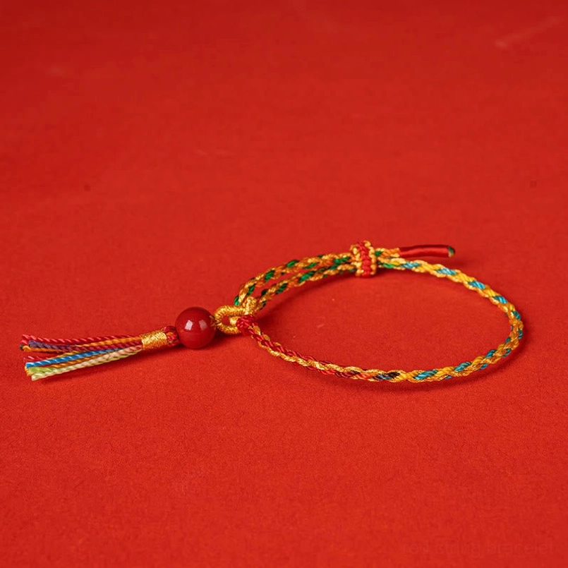 Close up detail of handwoven colorful cinnabar bead bracelet