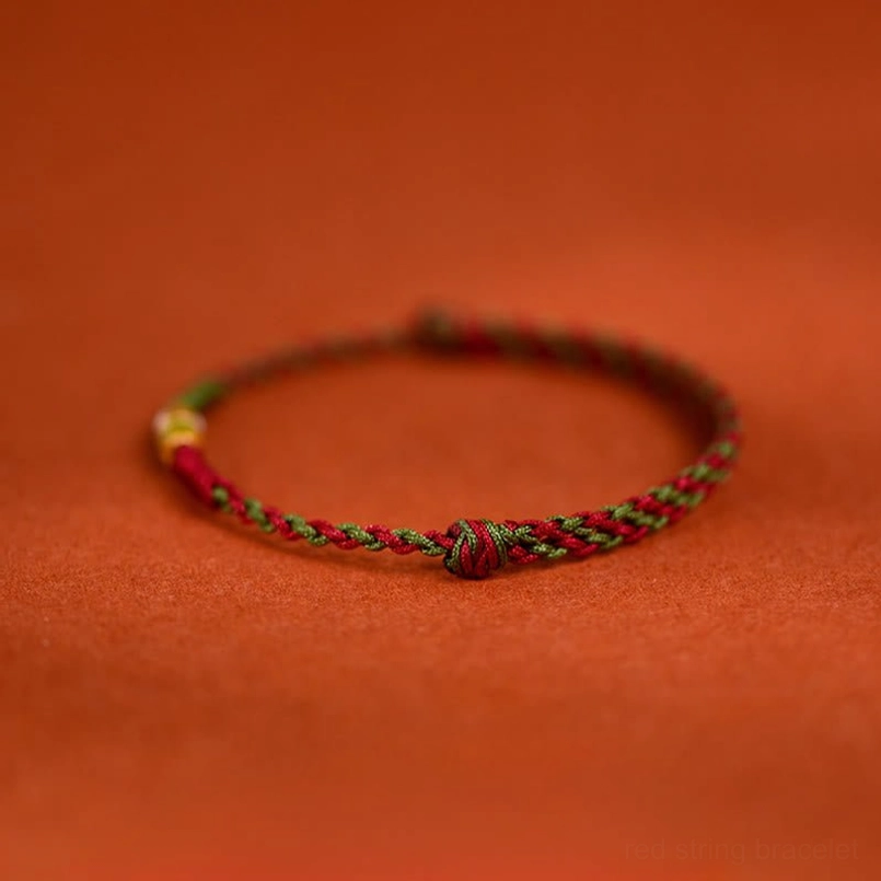 Handwoven koi fish red string bracelet with gold plated charm