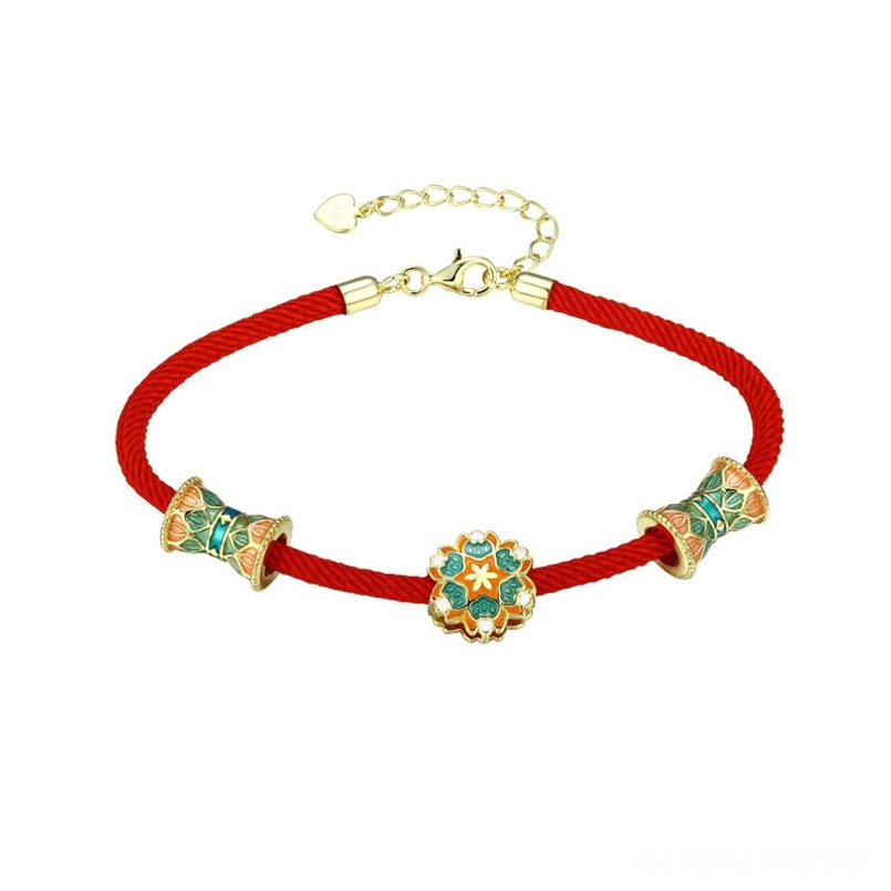 Detail shot of handwoven premium red rope of 925 sterling silver lotus bracelet