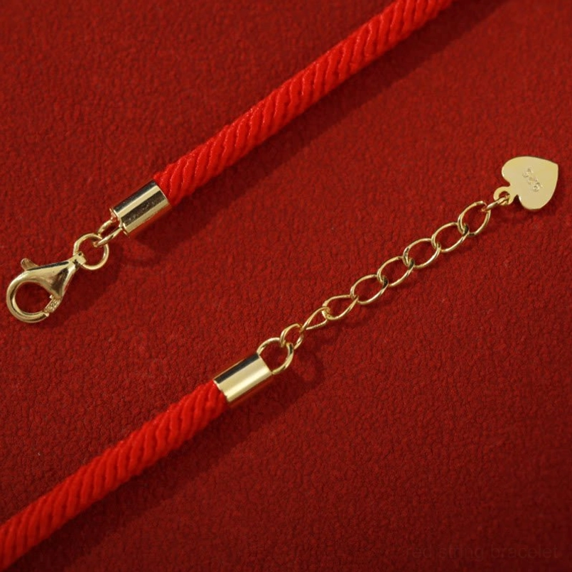 Lobster clasp and heart tag hardware details of 925 silver red string bracelet
