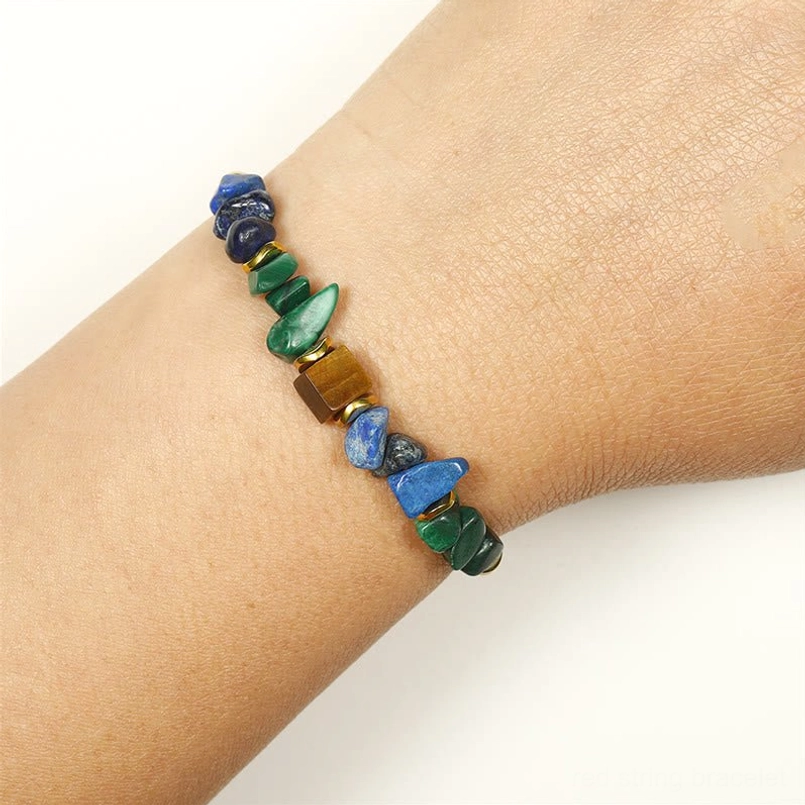 Malachite tiger's eye lapis lazuli beaded bracelet worn on slim wrist showing fit and mixed stone colors