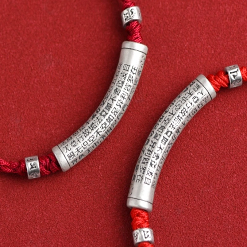 Spiritual protection bracelet with red string and engraved Om Mani Padme Hum silver charm