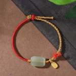 Hetian jade 925 sterling silver red string prosperity bracelet flat lay