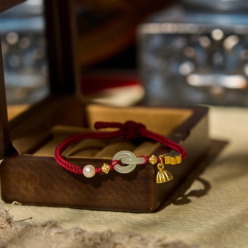 Hetian jade peace buckle bracelet displayed in vintage jewelry box with fabric presentation