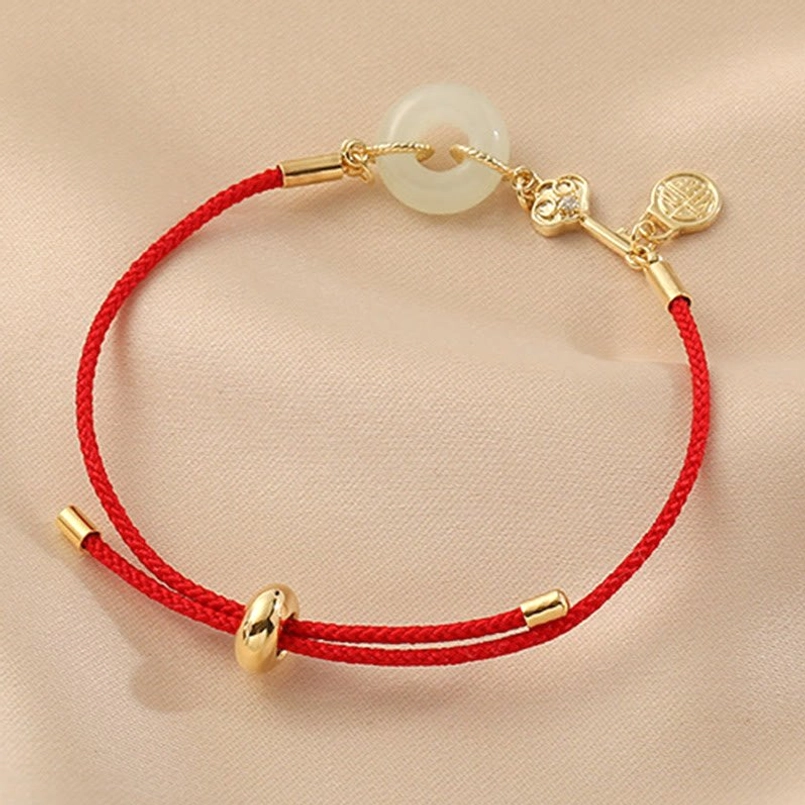 Hetian jade peace buckle red string bracelet with curved gold connectors and sliding closure