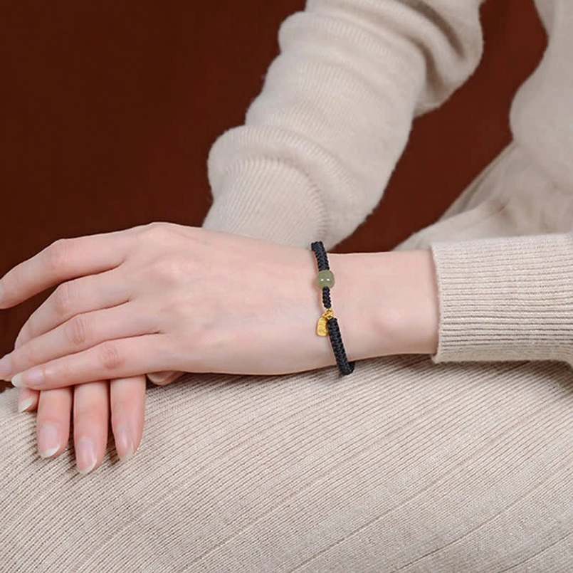 925 sterling silver components on Hetian jade red string bracelet - material quality closeup