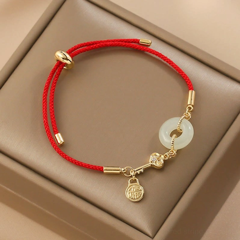 18K gold plated Hetian jade peace buckle red string bracelet with Fu character charm on beige gift box
