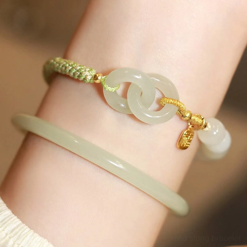 Hetian jade double peace buckle fu bracelet showing interlocking jade buckles with gold fu character charm