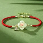 Hetian jade magnolia butterfly red string bracelet 925 sterling silver side view overhead