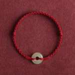 Dark red hetian jade peace buckle red string bracelet front view