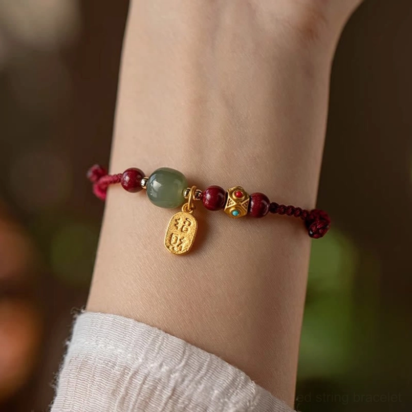 Fortune jade bracelet worn on wrist with linen sleeve, side close-up showing comfort fit