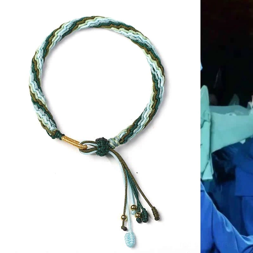 Hand-woven protective jade bracelet with green tone weave and simple metal bead tassel for daily wear