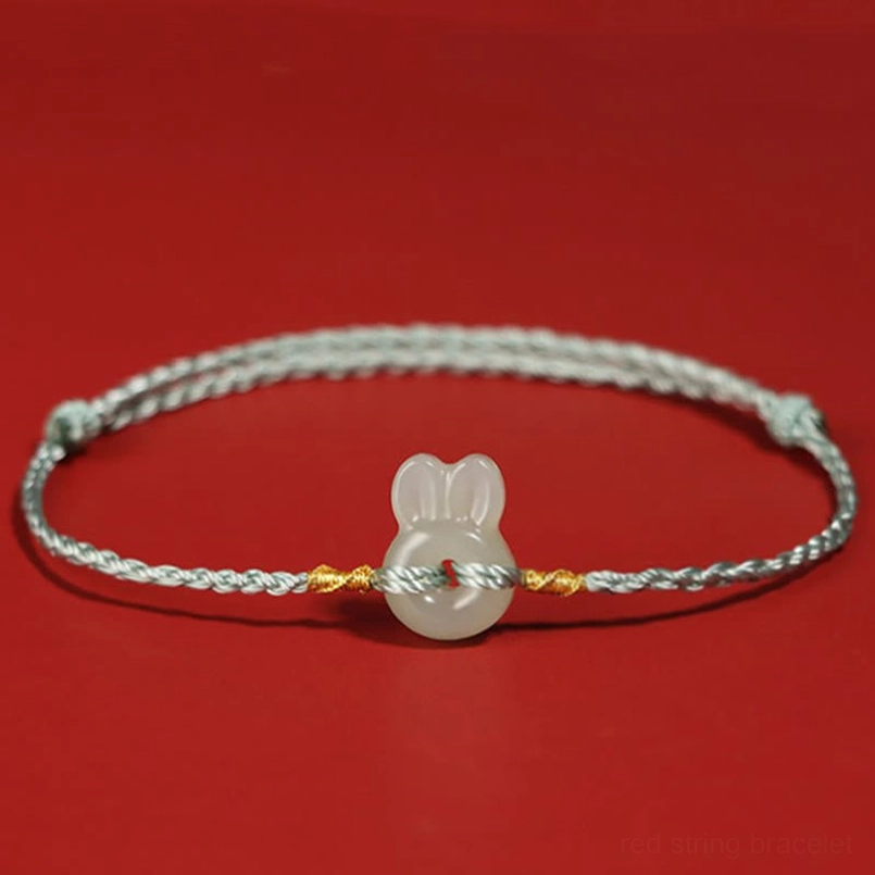 Gray braided rope Hetian jade rabbit bracelet with adjustable knots and gold detailing