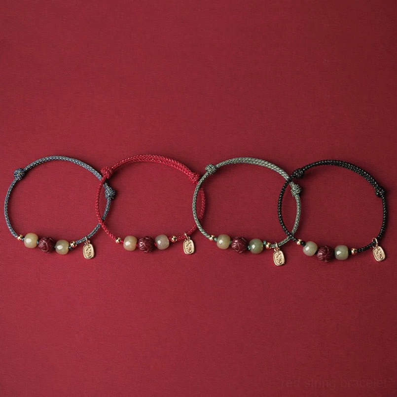 Handcrafted red string lucky bracelet with natural jade beads and lotus charm - authentic materials
