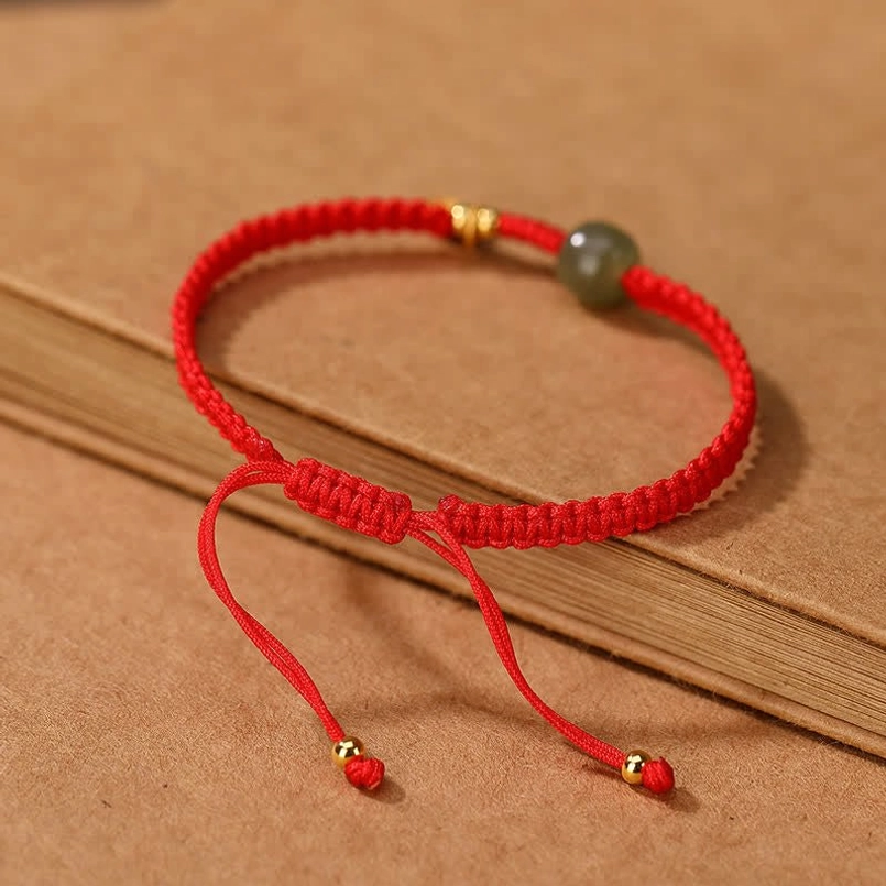 Red jade blessing bracelet with woven cord and 925 silver gold-plated components