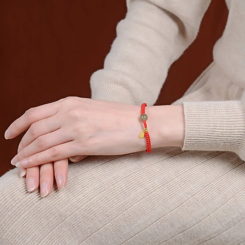 Hetian jade red string bracelet worn on wrist - daily wear close-up