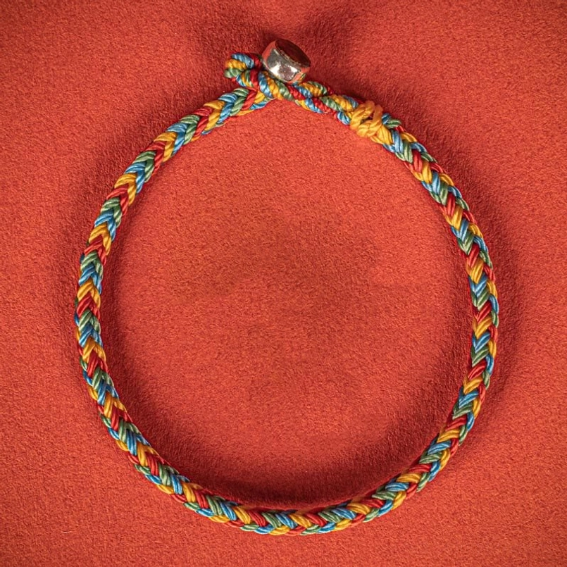 High Overhead View Eight Thread Peace Knot Red String Bracelet