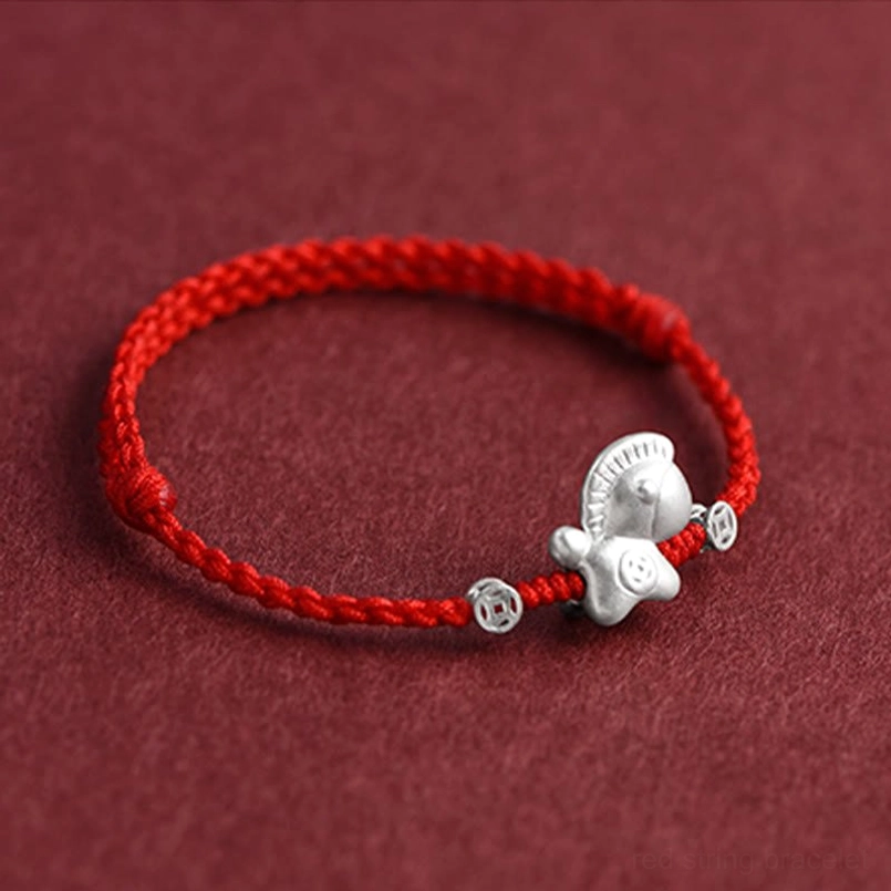 Side profile of Year of the Horse red braided bracelet showing depth and layered knot construction