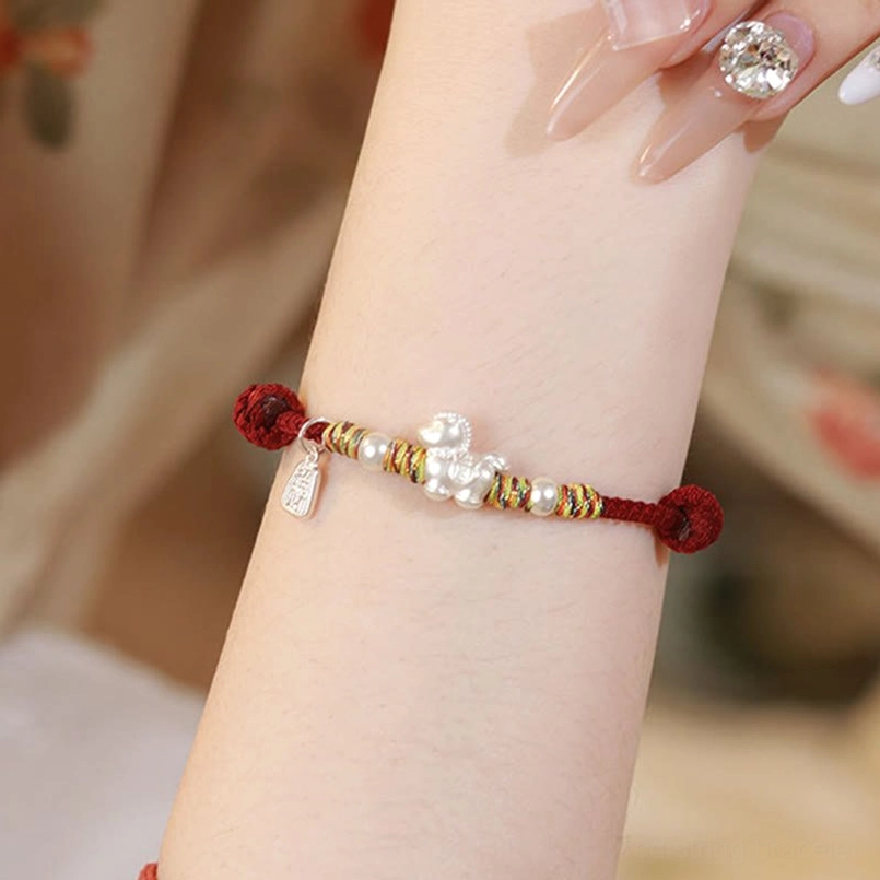 Horse zodiac silver bracelet on wrist with manicured nails styling