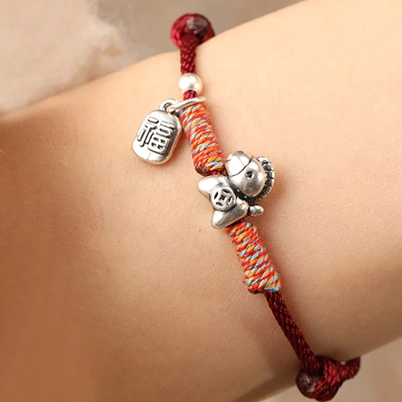 Year of the Horse fu character silver charm bracelet with red braided cord and woven accent wrap