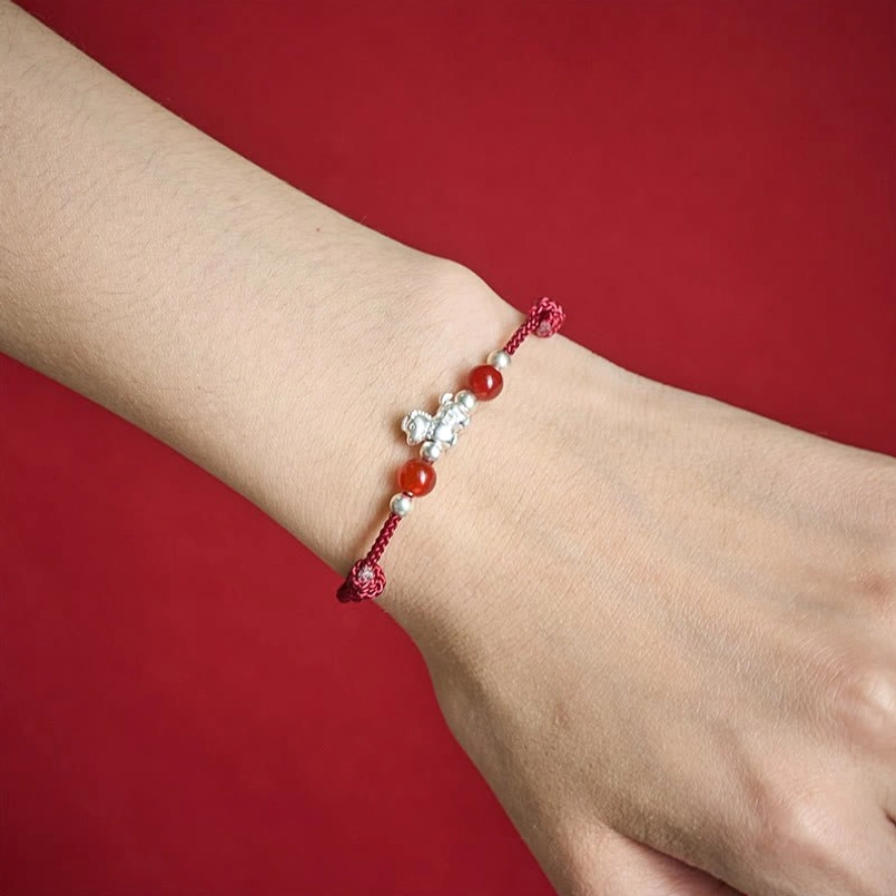 Worn dark red horse red agate bracelet on wrist side view daily wear
