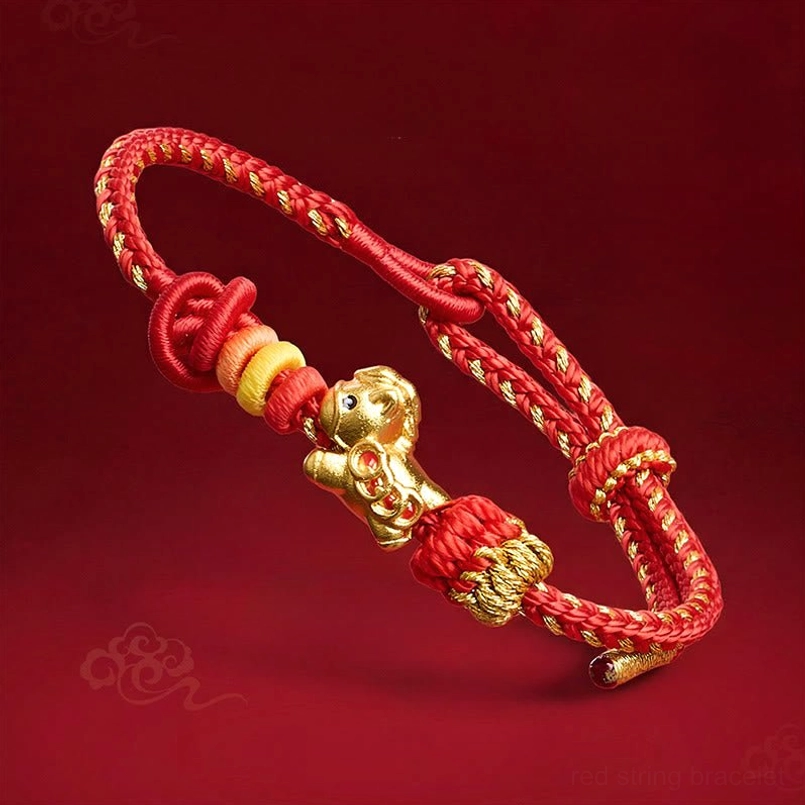 Year of the Horse red string bracelet with golden horse charm - oblique view