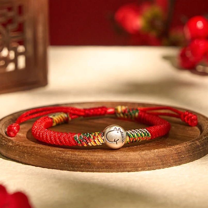 Zodiac Horse red string bracelet oblique view showing colorful woven sections