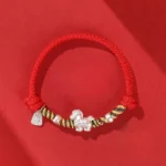 999 sterling silver horse red string bracelet with fortune charm flat lay