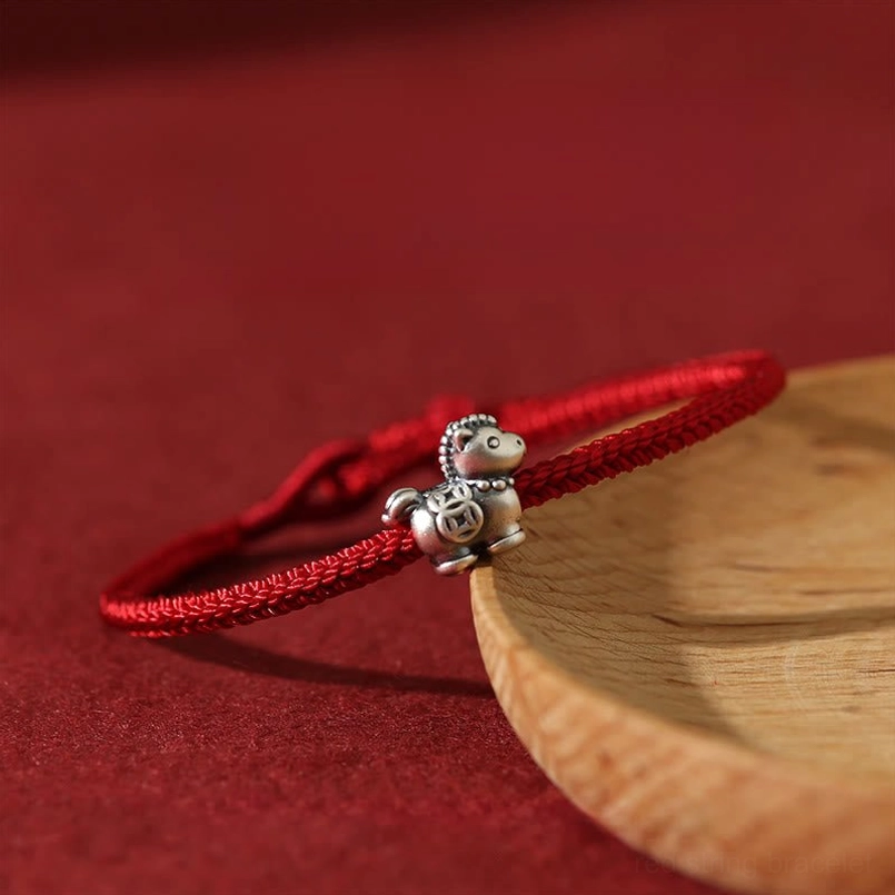 Sterling silver horse charm on braided red cord red string luck bracelet side view