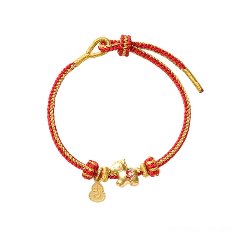 Flat lay of adjustable red string horse bracelet with brass horse and gourd tags on white background