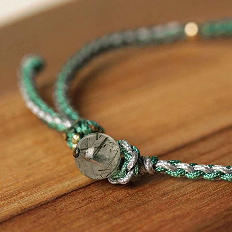 Rutilated quartz bead jade bracelet with green woven cord and protective energy stones
