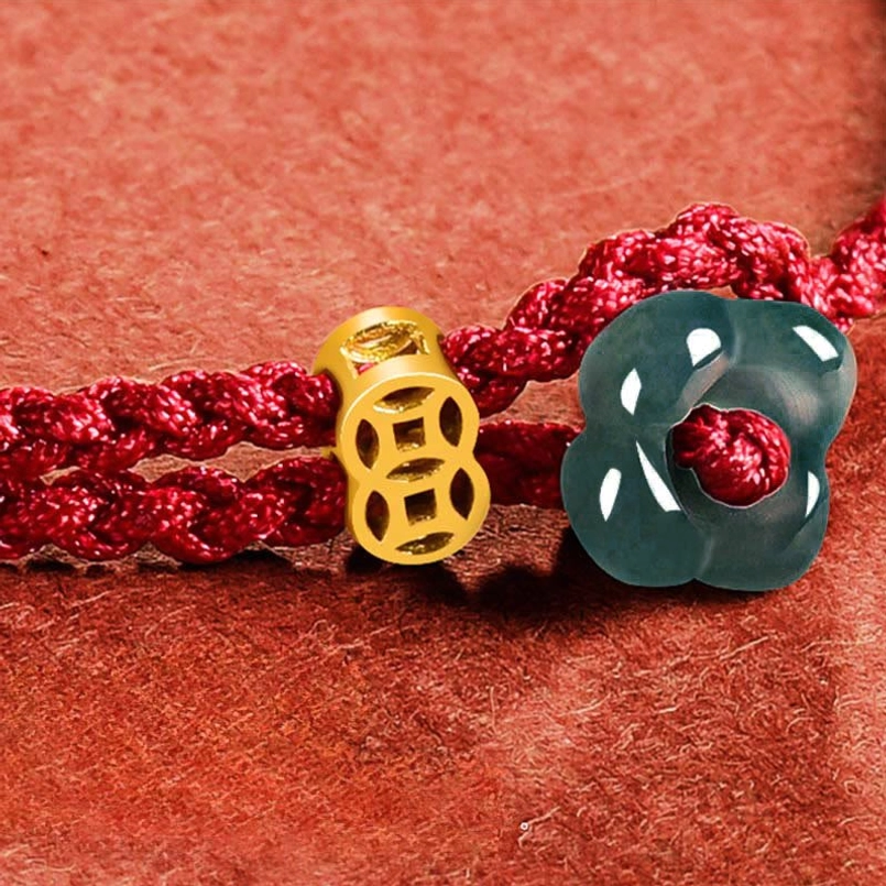 Jade flower and hollow gold copper coin charm extreme close-up detail