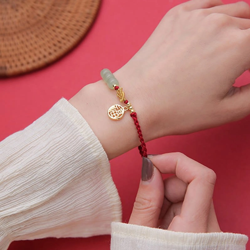Handcrafted jade fu character bracelet showing natural color variations authenticity