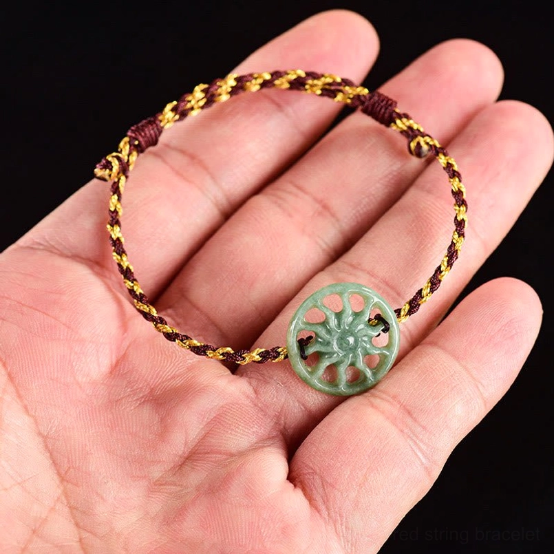 Jade sun bracelet held in palm showing real size reference