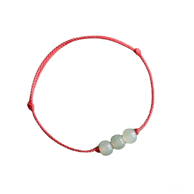 Three jade beads bracelet with red cord on white background - clean product view