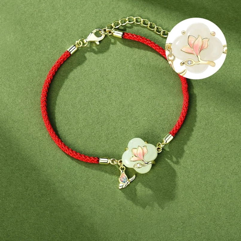 Close-up magnolia jade charm hetian jade pendant with gold hardware detail magnified