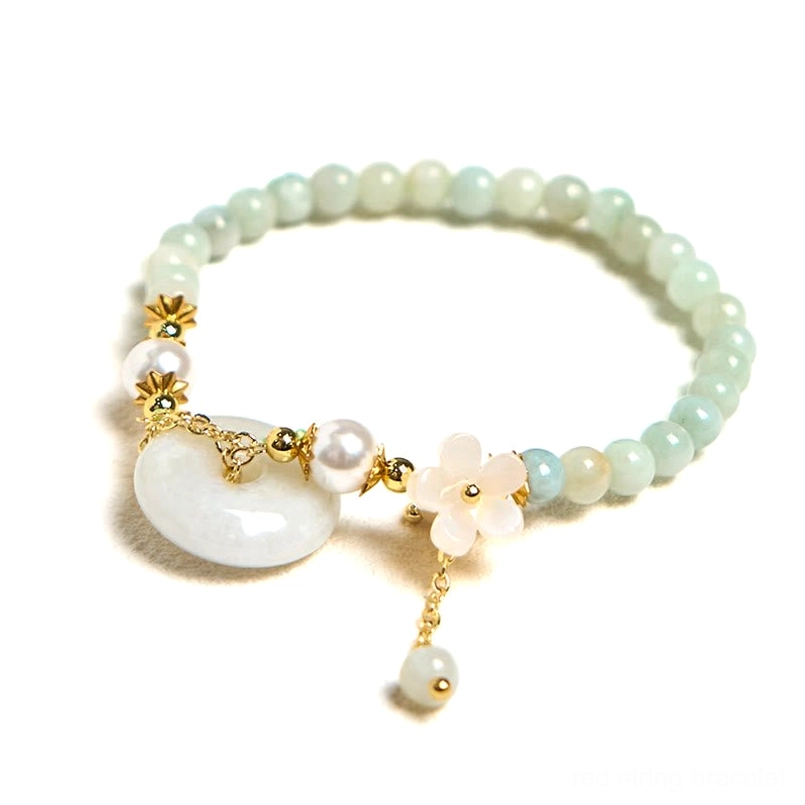 Jade peace buckle bracelet frontal view with floral charm and gold tone hardware details