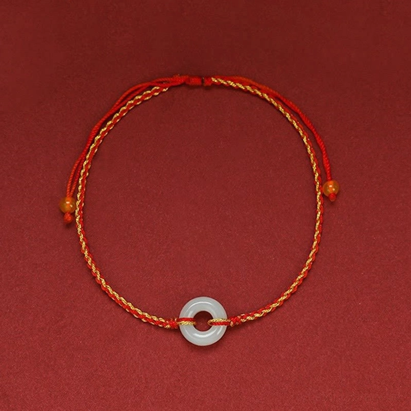 Full loop of jade peace buckle red string bracelet with centered white jade pendant and orange accent beads