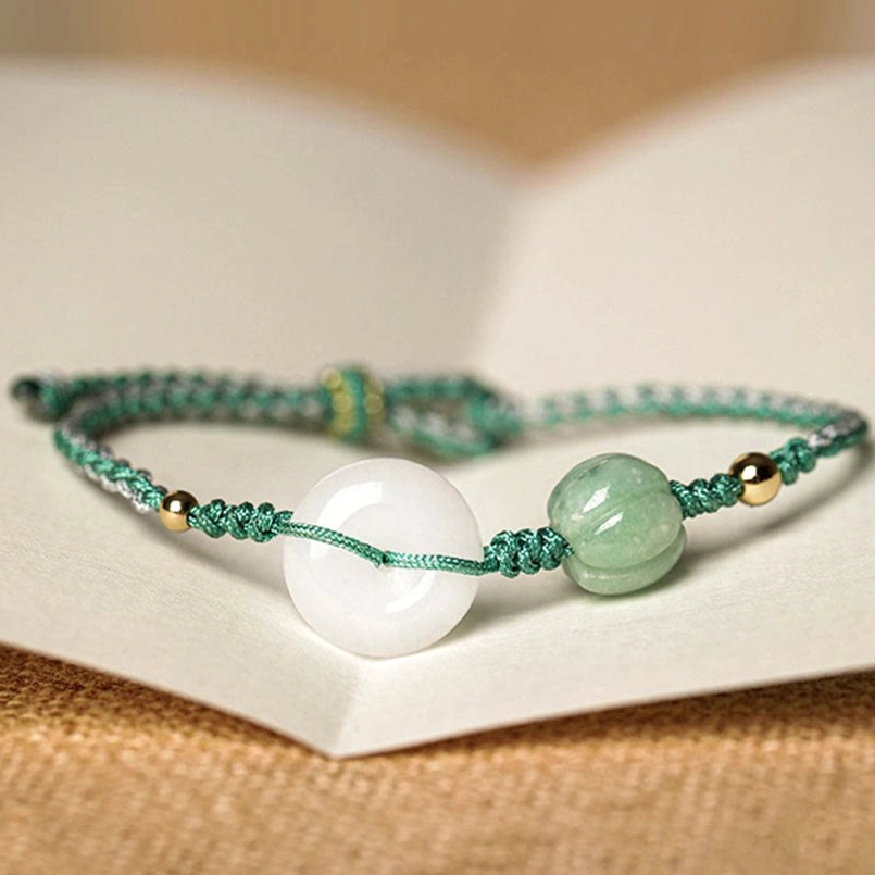 Green braided peace buckle jade bracelet with white jade and pumpkin bead details