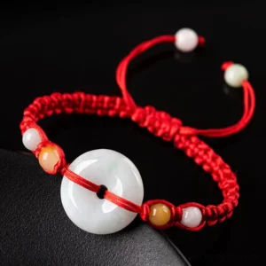 Jade Peace Buckle Luck Red String Bracelet close up on dark matte background